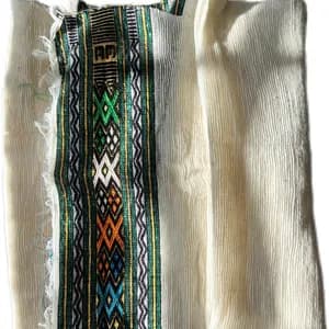 White hand-spun cotton Netela prayer shawl with a woven decorative border.